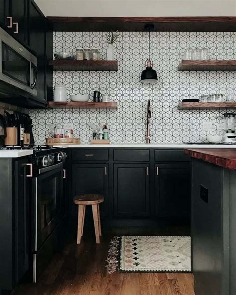 Mixing black and white tiles with gray ones keeps this beautiful. 10 Beautiful Black Kitchens That Make Us Swoon in 2020 ...