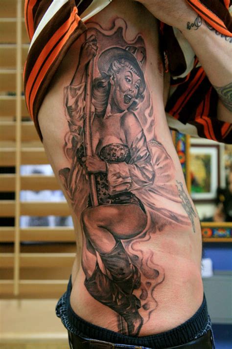 Pin up girls tattoo designs. fireman-pin-up-design-of-tattoos - Design of TattoosDesign ...