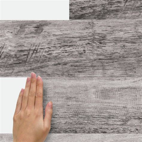 Love this easy real barnwood wall treatment. RoomMates Gray Barn Wood Plank Peel and Stick Giant Wall ...