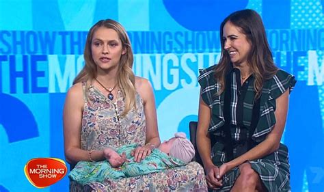 We did not find results for: Teresa Palmer appears happy and relaxed as she cradles her ...