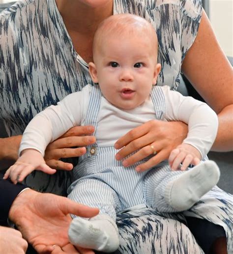 Prince harry and meghan markle pose with little archie and their family including prince charles and camilla, doria ragland, lady jane fellowes, lady adorable baby archie shows off a whisper of hair in his official christening snapscredit: Meghan Markle and Prince Harry discuss their very chatty son