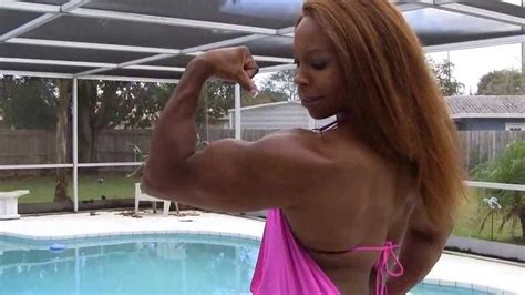 Find the perfect woman flexing muscles stock photo. Black Muscle Woman posing and flexing her big muscles ...