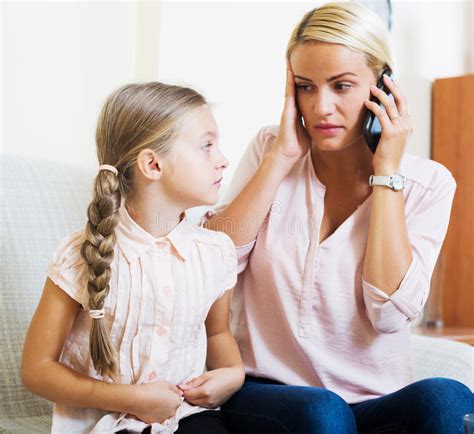 How old is your daughter? Worried Mother Calling Doctor For Daughter With Abdominal ...