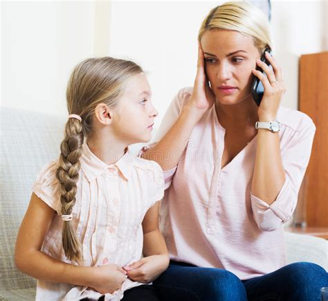 The expectant parents are considering naming her after the. Worried Mother Calling Doctor For Daughter With Abdominal Pains Stock Photo - Image of pancreas ...