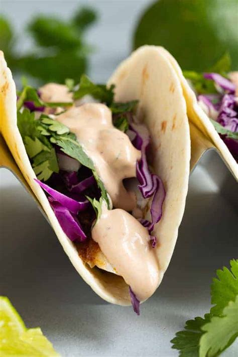 Spread on bottom of a tortilla, then layered shredded cabbage, salsa, chopped onion, pieces of cooked battered cod and more fish. Best Fish Taco Sauce Recipe | Sauce Fanatic