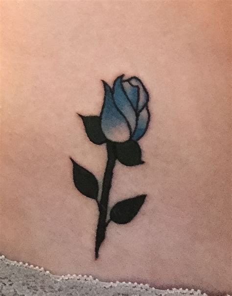 The rose bud tattoo would suggest that the person having it is versatile, flexible, creative and romantic. I got my first tattoo today of a blue rose bud on my hip ...