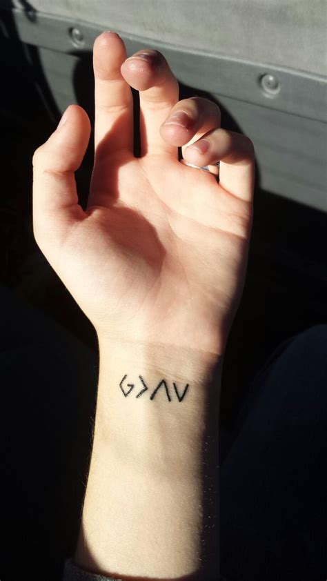 The mountains behind connect it with the symbolic interpretation, while the crosses make it look like a graveyard. My first tattoo; God is greater than the ups and downs (or ...