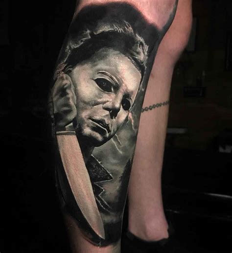 'bible scripture' tattoo on his right arm. Tattoo artist Damon Holleis