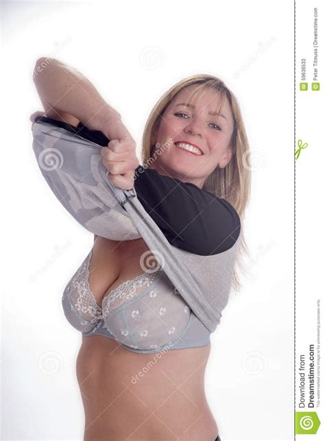 Wanna be secretary gets undressed. Vrouw Die Haar Kleding Verwijderen Stock Afbeelding ...