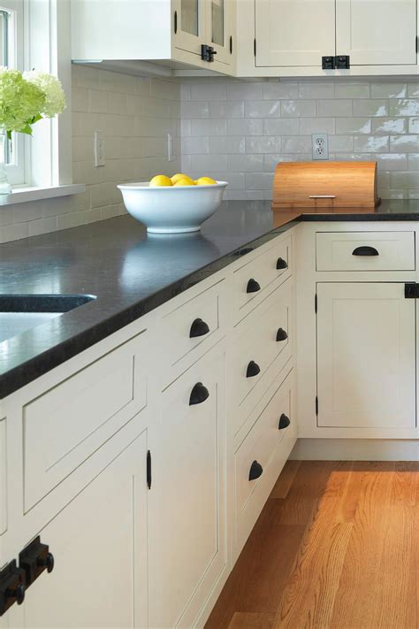 White shaker cabinetry with black countertops and glass by south shore decorating. White Kitchen Cabinets With Black Hardware | Countertopsnews