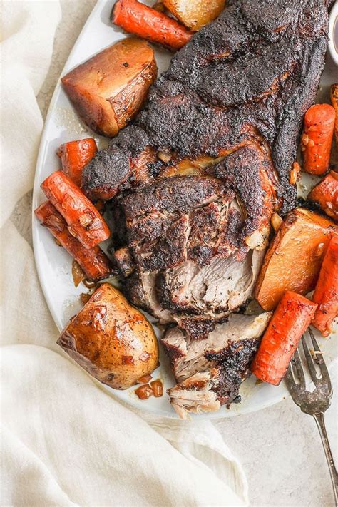 Put the onions and carrots into a large roasting tin, drizzle with olive oil and shake around to coat. This slow cooker pork roast is fall off the bone delicious ...
