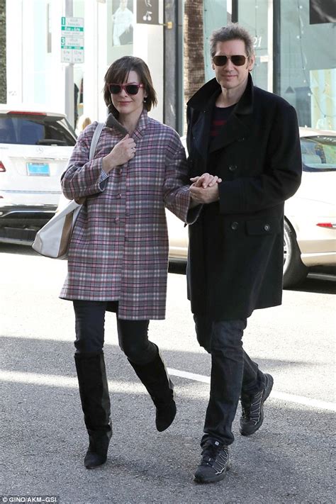 Milla jovovich and paul w. Milla Jovovich and husband Paul WS Anderson stay warm in ...