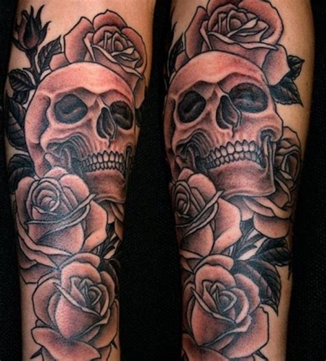 Silver skull with roses on the forearm. 51 Skull Tattoos For Men and Women - InspirationSeek.com