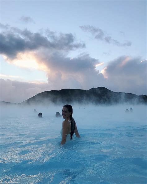 She pulled the lycra swimsuit over her body. Iceland- watching the sunrise from the Blue Lagoon. (With ...