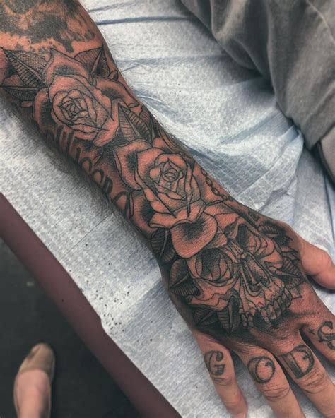 Lone star tattoo studio is located in dallas, texas near the city of plano. Black and Grey skull and roses hand/sleeve tattoo by ...