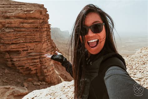 A saudi gentleman taking a picture of the cliff. The Incredible Edge of the World in Saudi Arabia is ...