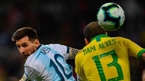 A brazilian defender throwing the ball before the argentine player laguna reaches it, during the argentina v. Argentina vs Brazil Live streaming, TV Channels, team news ...