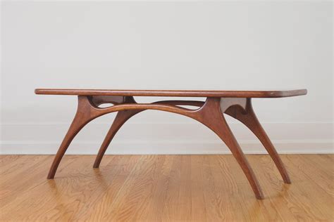 This piece is a timeless classic with all the functionality we have come to expect from danish modern design. MCM Teak Coffee Table