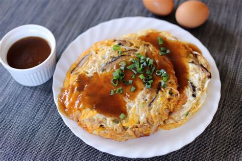 This egg foo young recipe is a delicious light airy chinese omelette filled with red pepper, celery, mushrooms, onions, bean sprouts, scallions and chicken smothered in a flavorful tangy gravy that will leave you licking your plate. This Asian #omelette is better than your usual omelettes ...