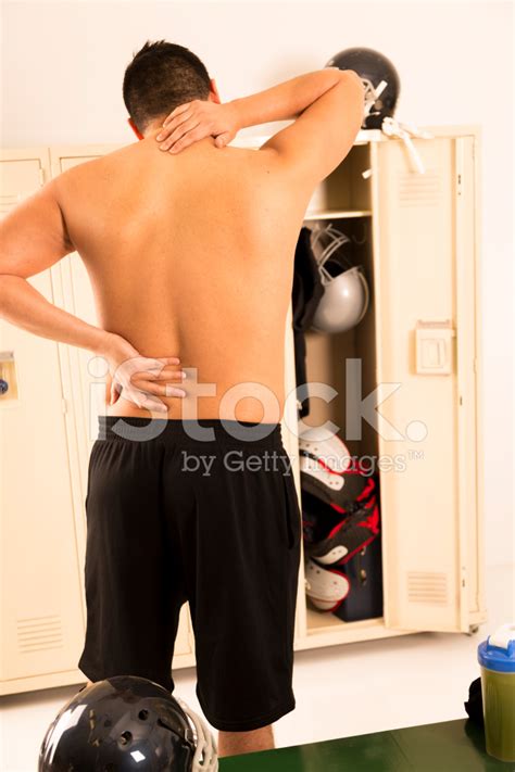 Someone she hadn't seen before was walking into the gym, sauntering his way toward the locker room. Medical: Male Athlete With Back, Neck Locker Stock Photos ...