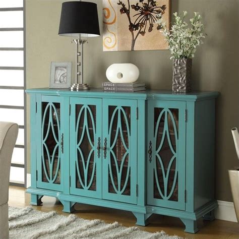 They add both form and functional appeal by breaking up the monotony of repetitive cabinet fronts, allowing you to proudly display decorative dishware or cherished keepsakes. Coaster Console Table with Glass Doors in Teal - 950245ii