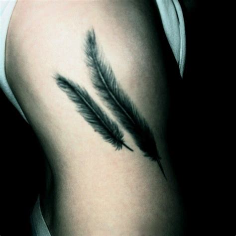 Check spelling or type a new query. Feather rib tattoo | Feather tattoo black, Feather tattoos ...