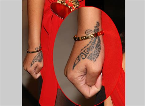 Rihanna has a discrete taste for tattoos and she knows where to place her tattoos to put them check out rihanna's 14 tattoos with their meaning and appreciate her love for tattoo art with us. Rihanna Tattoos