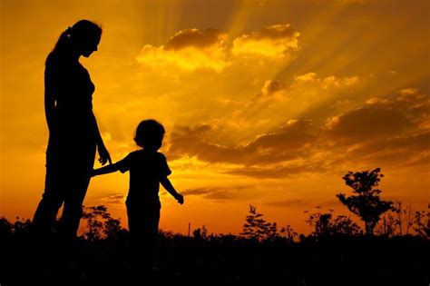 Her sister, yuki, brought her from japan with her son's sign. silhouette of a mother and son who play outdoors at sunset ...