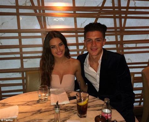 The two were what seemed to be together on holiday. Jack Grealish pictured sprawled on road surrounded by ...