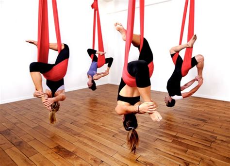 Aerial poses allow you to build greater balance than you might get from performing the same poses on the floor. Lifting off at an aerial yoga class