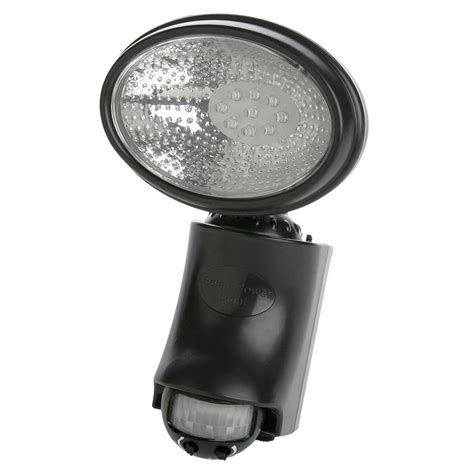 Lights are motion sensitive up to 70' away. Defiant 110 Degree Black Motion Activated Outdoor Flood ...