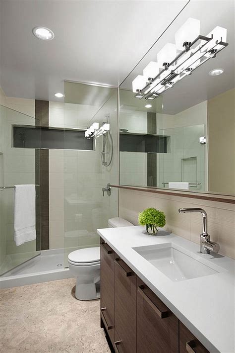 It's best to get a light fixture that is between ⅓ to ½ the width of the mirror and center it over the mirror, such as a bath bar or vanity strip. 32 good ideas and pictures of modern bathroom tiles texture