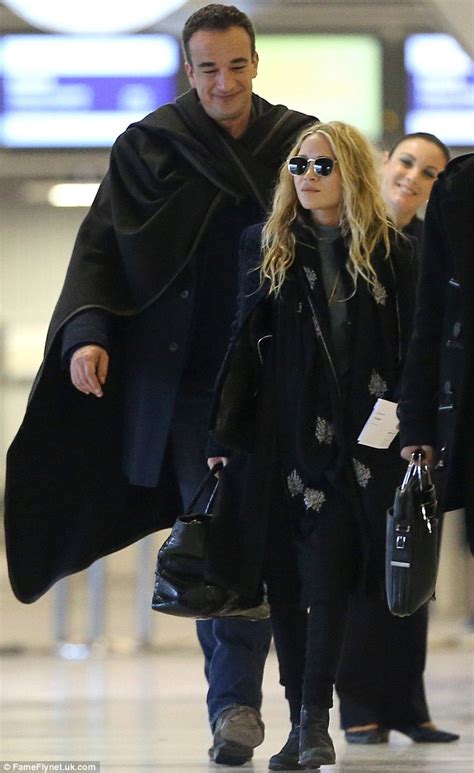 Congratulations to the happy couple, if the news is true! Mary-Kate Olsen and a content-looking Olivier Sarkozy look ...