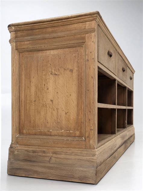 Made to your spec , be it more farmhouse or industrial we can make to order , it's a very chunky rustic, with seating area at one end one shelf and a drawer made out of scaffolding boards and scaffolding. Antique French Kitchen Island Made in White Oak at 1stdibs