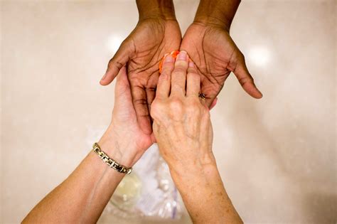 Hands of hospice workers blessed in prayerful ceremony ...