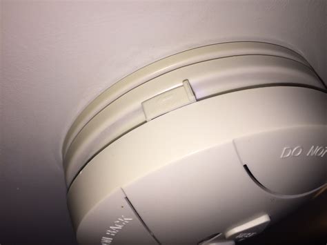 The nest protect smoke detector. alarm - How to open this smoke detector in order to change ...