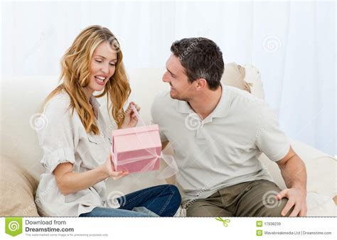 I want to give a special gift to my love, my lovely wife. Man Offering A Gift To His Wife Royalty Free Stock Images ...