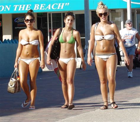 Milf takes a walk on the beach More of cameltoes!