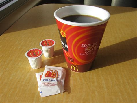 You can reduce the number of calories in your coffee drinks by reducing or eliminating the amount of sugar, cream and milk you put in. McDonald's Christmas Coffee Cup with Cream and Sugar 1 ...