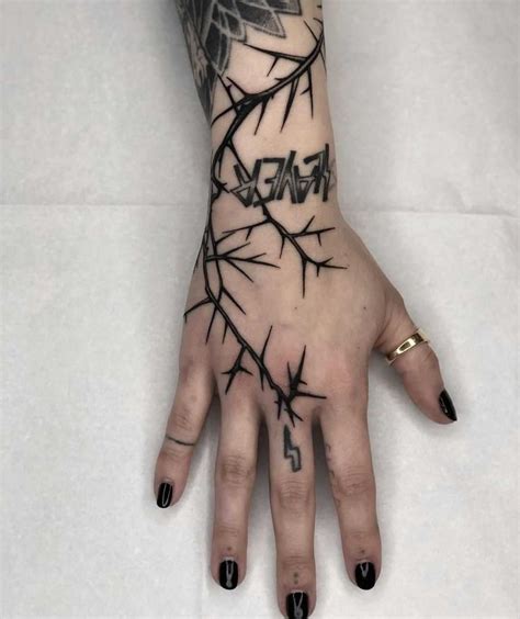 Thorny vines snaking through the skin make a unique tattoo design that's hauntingly beautiful as well. Lightning thorn tattoo by Tine DeFiore inked on the right ...