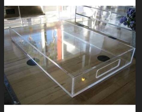 Styling tricks for round coffee tables clear coffee table round coffee table decor lucite coffee tables. Plexi tray table | Lucite coffee tables, Coffee table ...