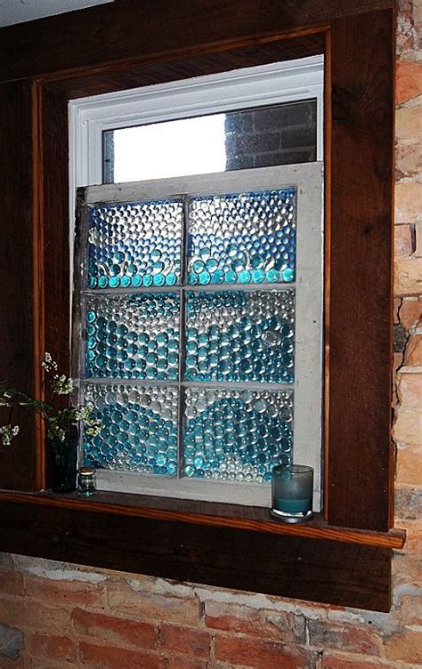 Folded washcloths tie the space together. privacy window made for my bathroom...my friend 'nette ...