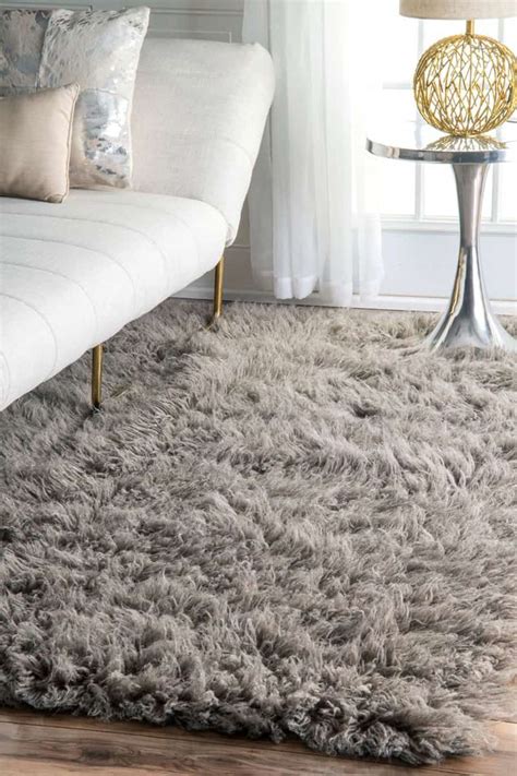 Ensure that each side has equal amounts of exposed flooring. How to Decorate Around a Shaggy Rug