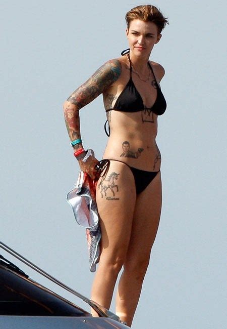 Ruby rose's right ribcage tattoo says so close no matter how far, couldn't be much more from the heart, forever trusting who we are and nothing else matters, which is a line from the song nothing. Ruby Rose Shows Off Bikini Body and Awesome Tattoos While ...