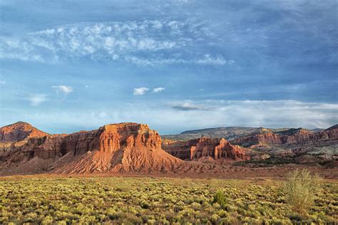 Panorama of red rocks and american flag waving on a beautiful summer day with blue sky. Capitol Reef National Park, Utah Photograph by Heeb Photos