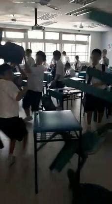 I think this one needs no explanation. Boys' school students throw tables, chairs in classroom brawl