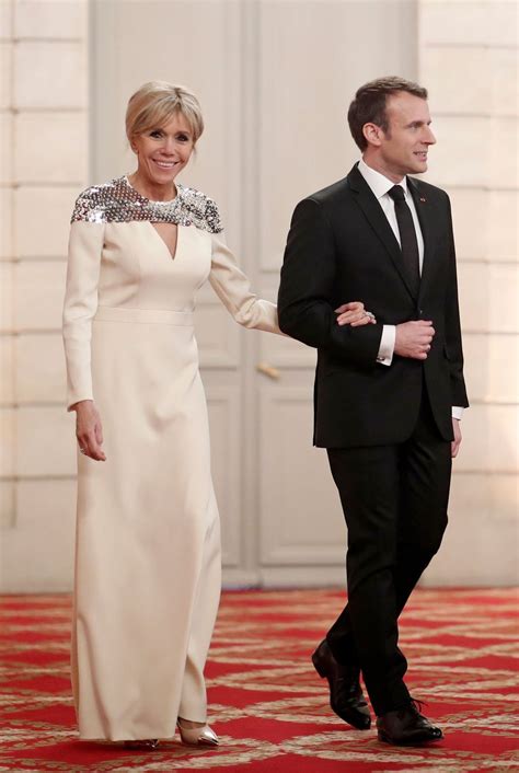 In fact they love to be photographed together. Brigitte Macron Wears a Mod Coral Look to the G20 Welcome ...