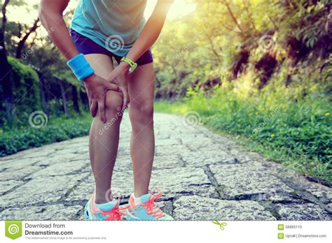 Fitness Woman Jogger Hold Her Sports Injured Leg At Forest Trail Stock Photo - Image of injured 