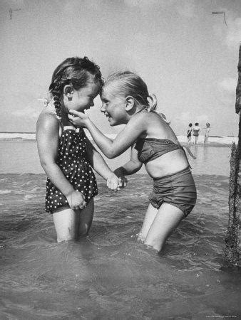 Not only this , girls and boys are brought together to play sports. 'Little Girls Playing Together on a Beach' Photographic ...