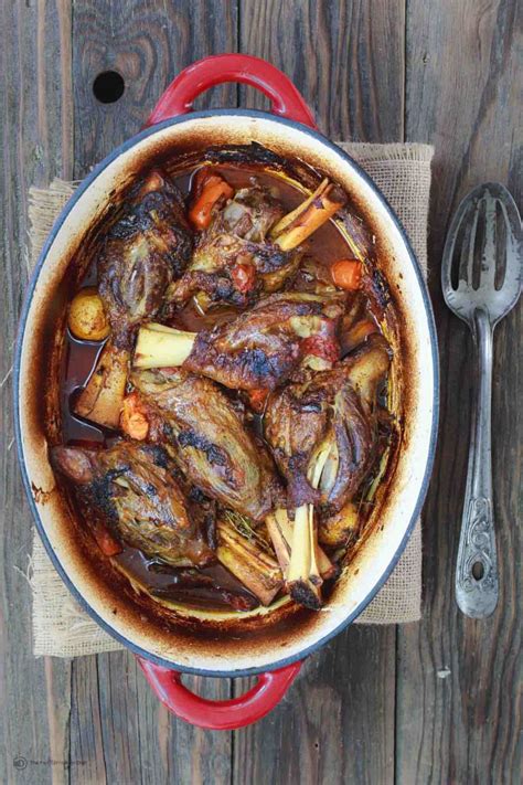 Braised lamb shanks slow cooked in an incredible port sauce. Mediterranean-Style Wine Braised Lamb Shanks Recipe | The Mediterranean Dish. Braising and slow ...